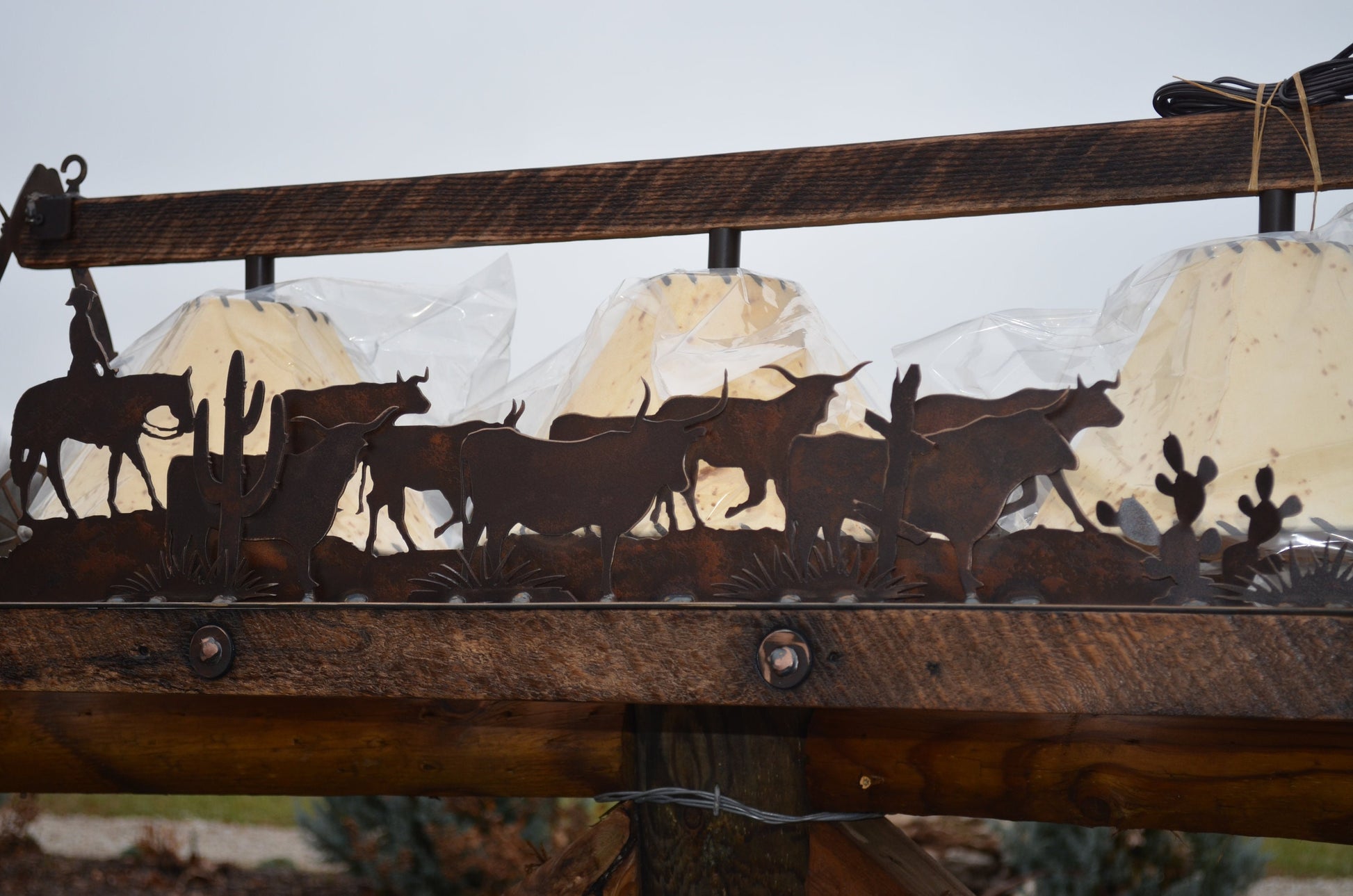 Rectangle Chandelier featuring cattle drive scene and sheepskin shades.